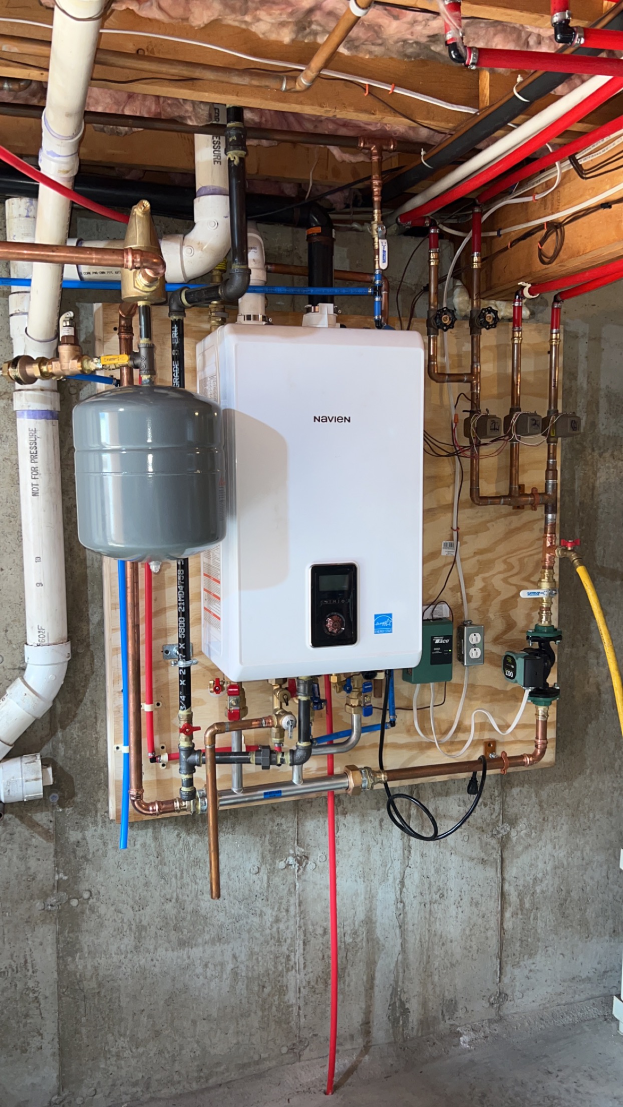 Navien tankless water heater system professionally installed by Zompa Plumbing & Heating